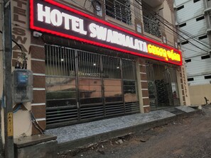 A hotel with a prominent sign reading "HOTEL SWARNALATA" and "GEMINI HOTEL." - Hotel Swarna Lata (Puri)