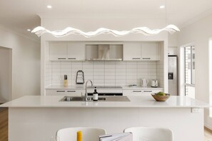 Fridge, microwave, oven, stovetop - Spacious 4BR Modern Home by Parks & Forest (Greenbank)