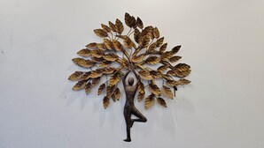 A wall art of a tree with a human figure in a yoga pose. - Shivam Guest House (Faizabad)