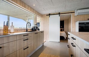 Fridge, stovetop, dishwasher, coffee/tea maker
