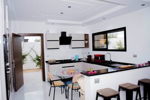 Fridge, oven, dishwasher, dining tables