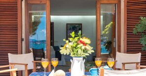 Enjoy a romantic meal for two in this beautifully set dining area with a lovely view.