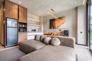 Comfort Apartment, 1 Bedroom, Terrace | Living area | 50-inch Smart TV with cable channels -  Work Stay and Unwind - Jungle Vista Apartments in Ubud by BCG (Ubud)
