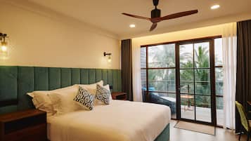 Deluxe Double Room, Balcony, Beach View | Minibar, in-room safe, desk, soundproofing