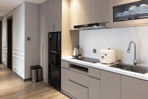 Superior Apartment | Private kitchen | Full-size fridge, microwave, cookware/dishes/utensils - Otis Apartment (Hanoi)