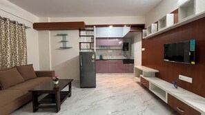 Executive Apartment, Balcony | Living area | 32-inch Smart TV with digital channels - SSN HomeStays in Bangalore Near La Casa (Kasavanahalli)