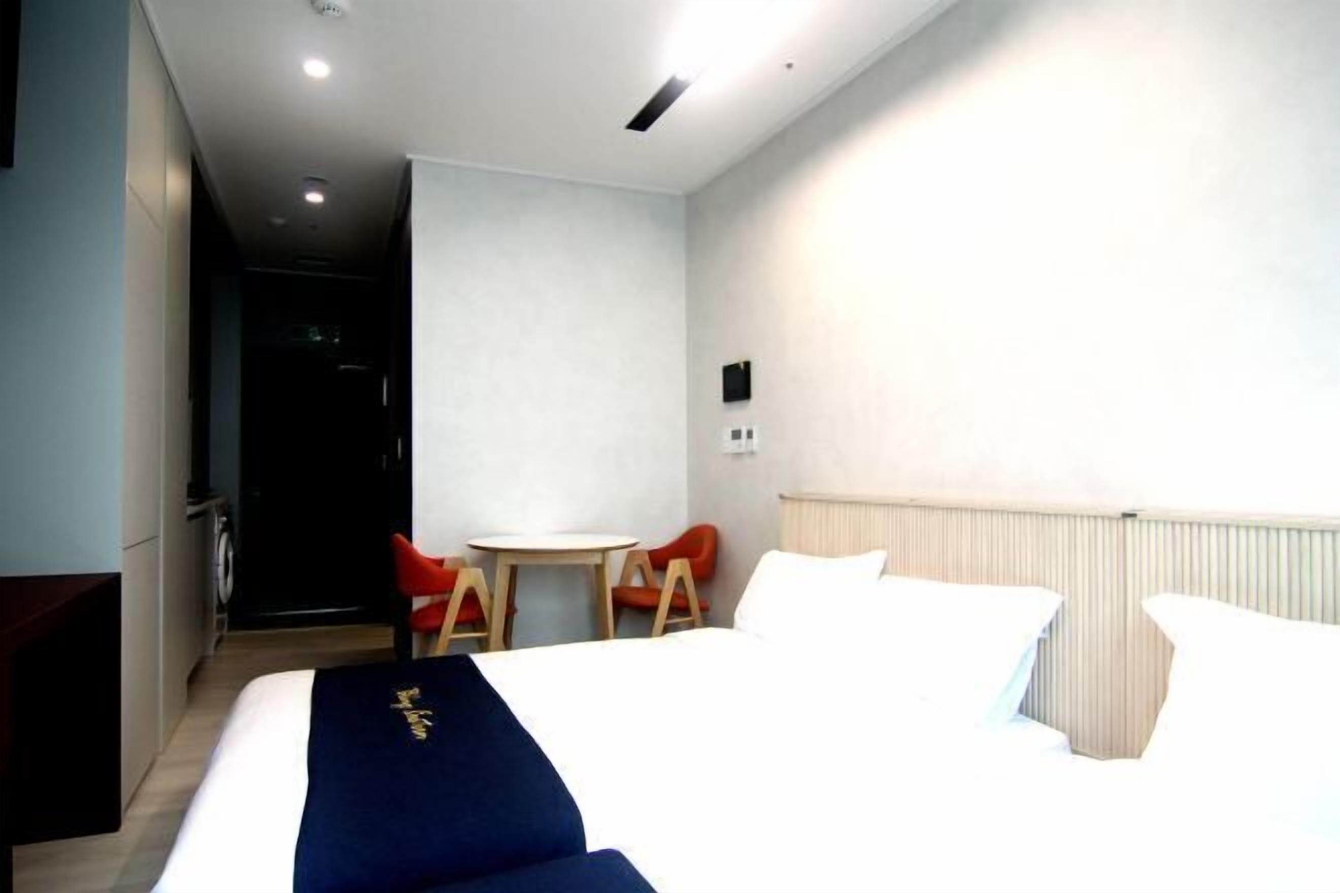 Desk, laptop workspace, free WiFi, bed sheets