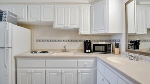 Fridge, microwave, stovetop, coffee/tea maker