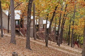 A residential area with multiple buildings, each with a staircase leading to a balcony.