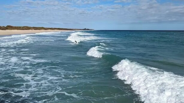 A beach with waves and a clear sky. - Coastal Getaway with game room pool hot tub & inlaw suite in heart of Sebastian (Sebastian)