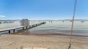 A pier extending into calm waters with a small building labeled 'SKYLAND' at the end. - < 2 Blocks to Lake Tahoe: Family Home Near Skiing (Homewood)