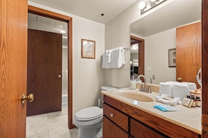 Shower, hair dryer, towels, shampoo