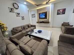 Smart TV, books - Ashoka Homes-Stylish-2 BHK apartment in lajpat nagar New Delhi with AC, WiFi (New Delhi)