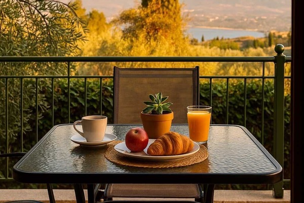 Balcony with a Sea & Valley Views – Enjoy your morning coffee overlooking the peaceful garden and distant landscape.