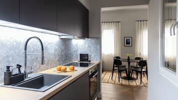Departamento, 1 habitación | Cocina privada | Refrigerador, horno, parrilla de estufa y cafetera de espresso