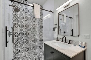 Shower, hair dryer, towels, soap