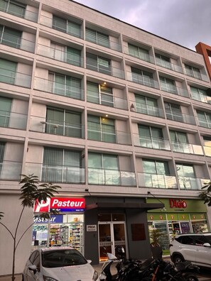 A multi-story building with a storefront at the ground level. - U-GO Belmonte Armenia (Armenia)