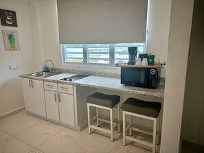 Fridge, microwave, stovetop, coffee/tea maker