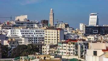 A densely packed urban area with a prominent tower and modern buildings.