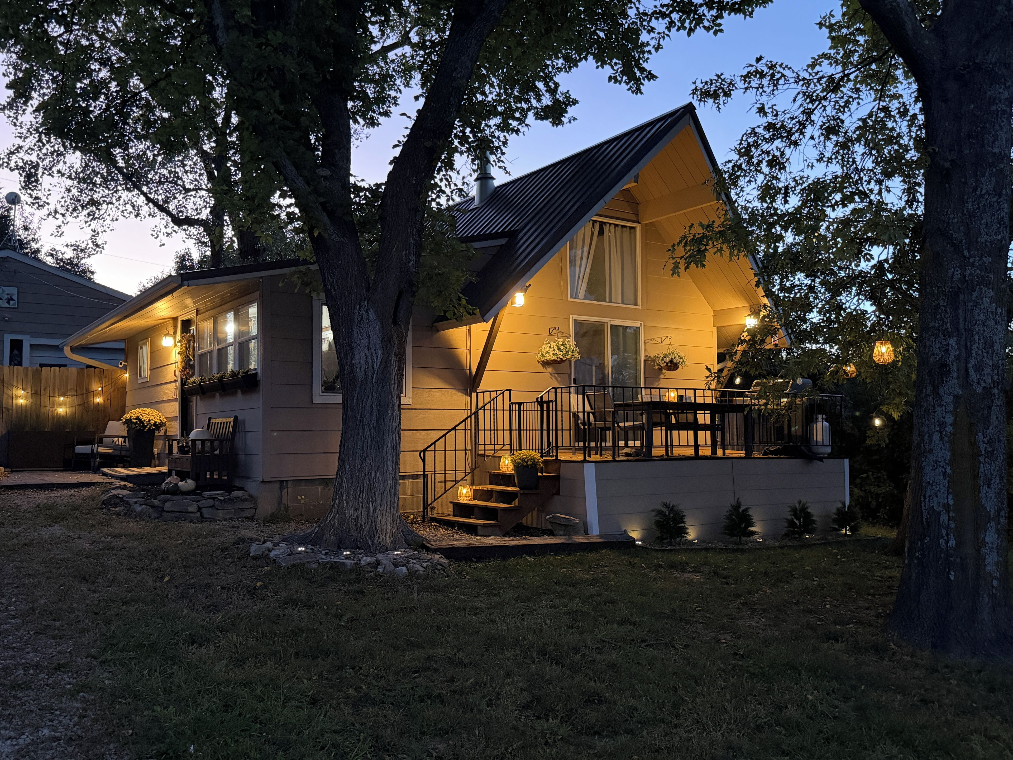 A two-story house with a balcony, a staircase, and a porch area.