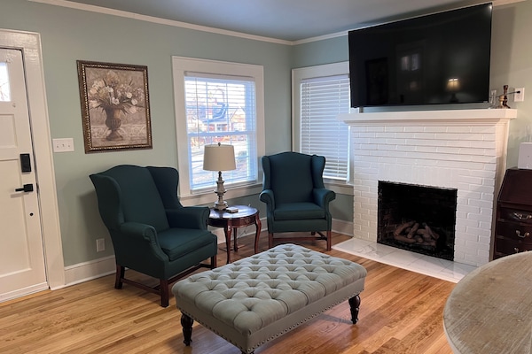 Relaxing living room with smart tv and gas log fireplace.