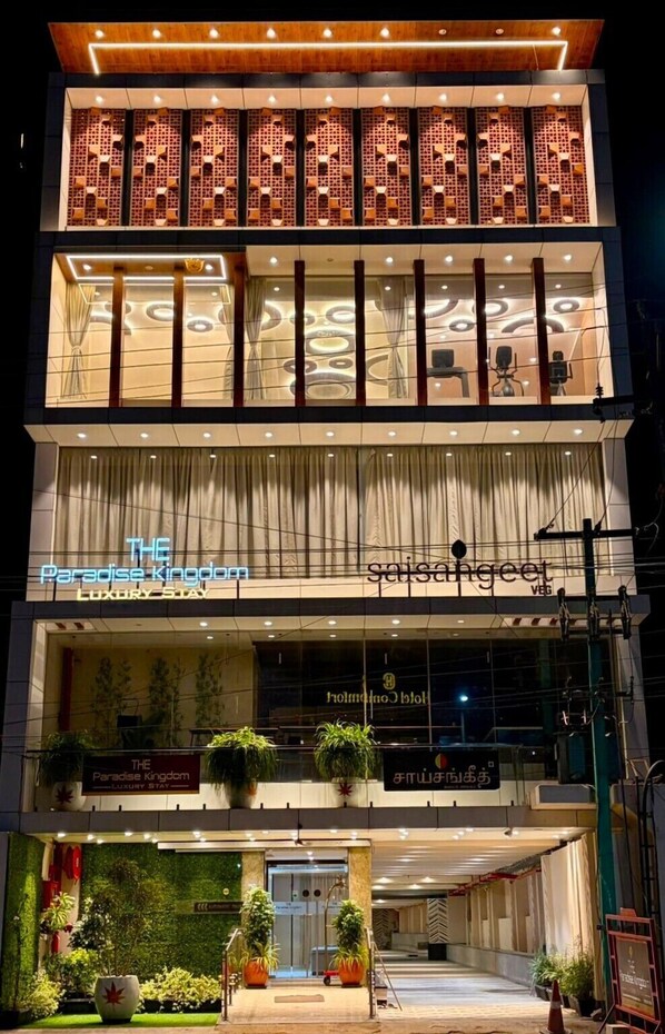 A multi-story hotel with a sign reading 'The Paradise Kingdom' and 'Saisanget.' - THE PARADISE KINGDOM (Kanchipuram)
