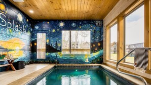 A swimming pool with a starry night mural, wooden ceiling, and large windows. - Lux Home-2 Master Suites-Heated Pool-Dollywood 5mi (Pigeon Forge)