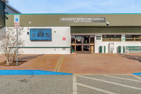 The Ocean City Recreation Complex East Entrance with a sign indicating reserved parking and a fee of $25.