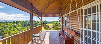 Charming cabin with private balcony, lush views & eco-friendly features