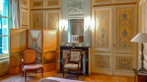 A room with a bed, two chairs, a desk, a mirror, and a lamp. - Lovely home in Ingouville sur Mer (Ingouville sur Mer)