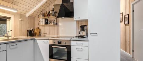 Fridge, stovetop, dishwasher, coffee/tea maker