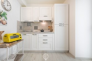Fridge, coffee/tea maker, cookware/dishes/utensils