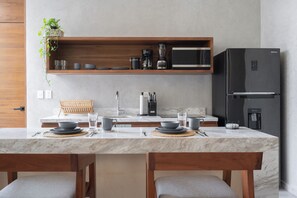 Fridge, microwave, stovetop, coffee/tea maker