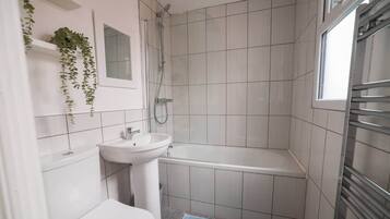 Hair dryer, towels, shampoo, toilet paper