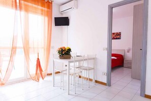 Dining - Two-room apartment of 45 sqm, consisting of a large living room/dining area with equipped kitchenette and sofa bed with 2 single pull-out beds, a double bedroom, bathroom with shower, private balcony complete with table and chairs.Equipped with:- Air con (Luni Mare)