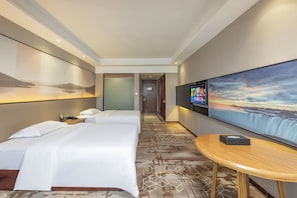 A hotel room with two beds, a large TV, and a view of a waterfall. - Tianjie International Hotel (Guilin)