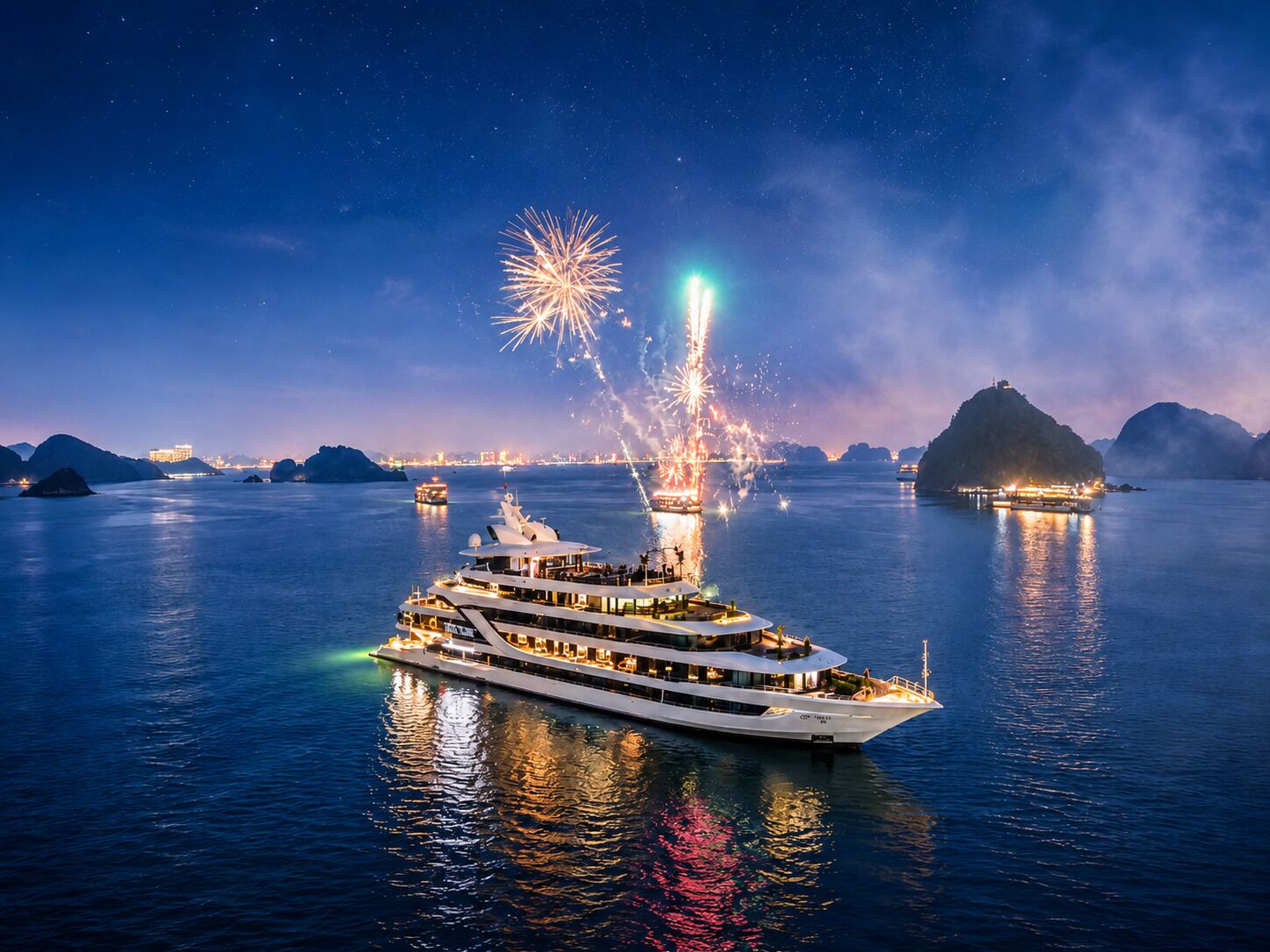 A large, multi-deck yacht with a modern design, sailing on calm waters at night with fireworks in the background.