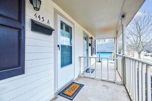 Welcome to 445 A, a charming home with a cozy porch and inviting entrance.