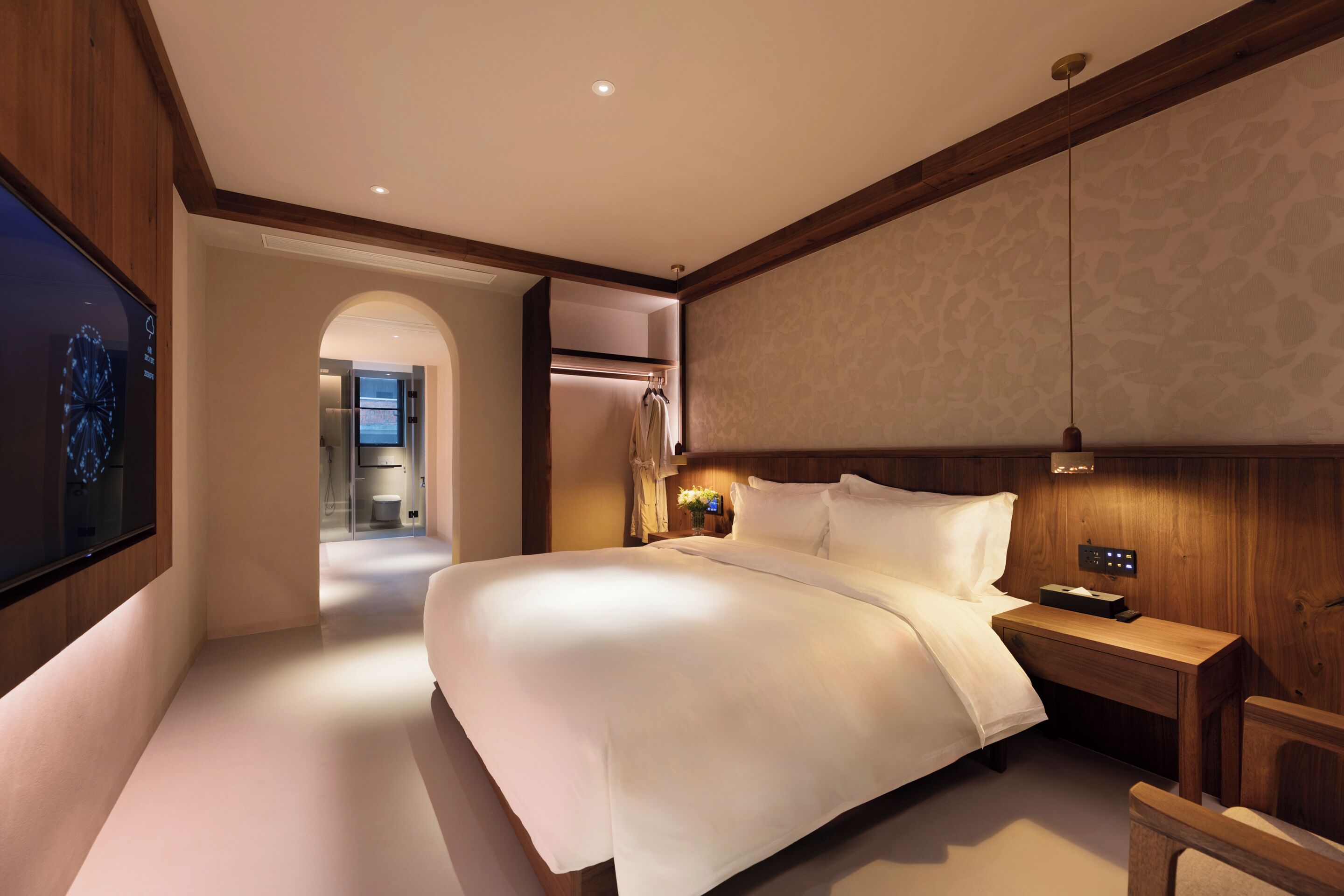 Deluxe Double Room, Courtyard View | Living area | 65-inch LCD TV with cable channels, toys, books