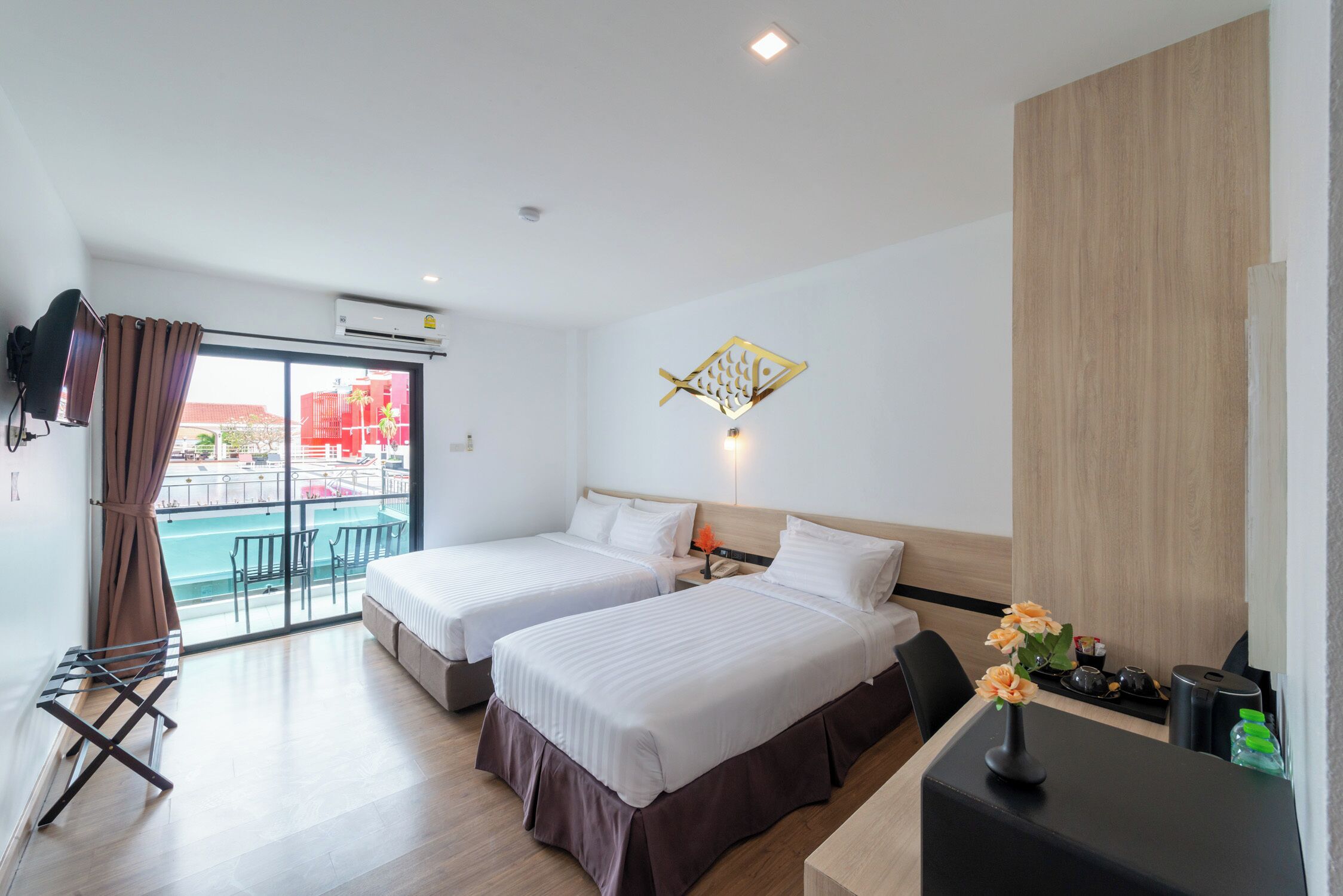 Deluxe Triple Room, Pool View | Minibar, in-room safe, desk, blackout drapes