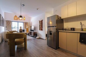 Fridge, microwave, stovetop, coffee/tea maker