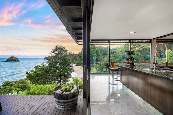 Enjoy expansive views of the ocean from this spacious balcony with a clear view of the beach.