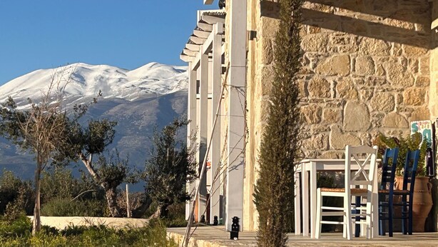 A building with stone walls and a view of a snow-capped mountain. - Quiet house in southern Crete, picturesque sea and mountain views, beach within walking distance (Pitsidia)