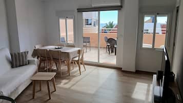 Standard Apartment, 3 Bedrooms, Sea View | Living area | Flat-screen TV