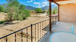 A balcony with a view of a dry, grassy landscape and mountains in the distance. - 11 Mi to Skiing: Valdez Home w/ Mtn Views! (Arroyo Seco)