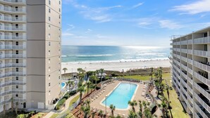 A high-rise hotel with a pool and beach view. - Seaside Beach & Racquet 5817 by Liquid Life (Orange Beach)