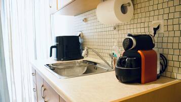 Fridge, coffee/tea maker, electric kettle, toaster