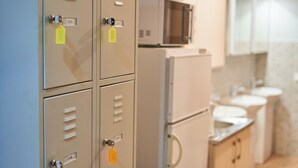 A kitchenette with a microwave, refrigerator, and cabinets. - Tokyo Vibes Hostel with more privacy (Self Check in) (Vilnius)