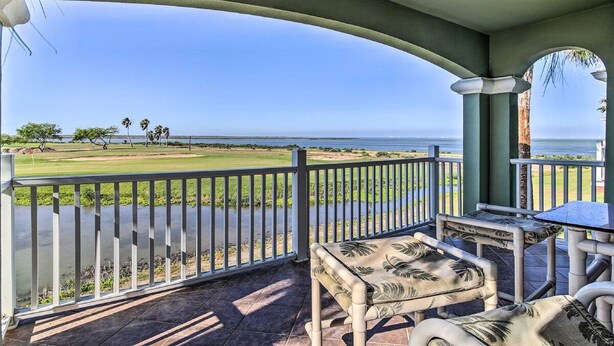 A covered outdoor area with a view of a golf course and the ocean. - Hole-in-One Vista! (Laguna Vista)