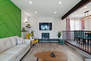 Smart TV, fireplace, books, offices